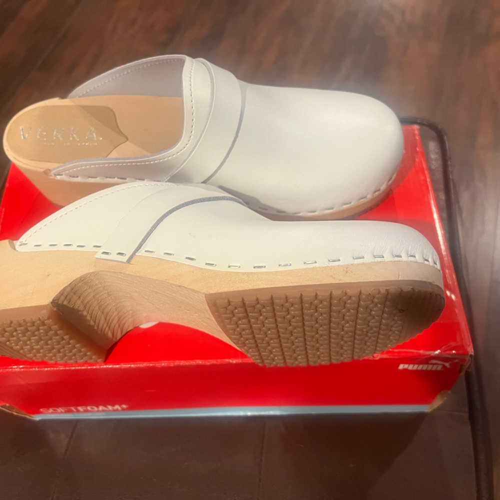 Brand new Nursing clogs. Super cute and comfortable. Wooden trim. NEVER WORN.
